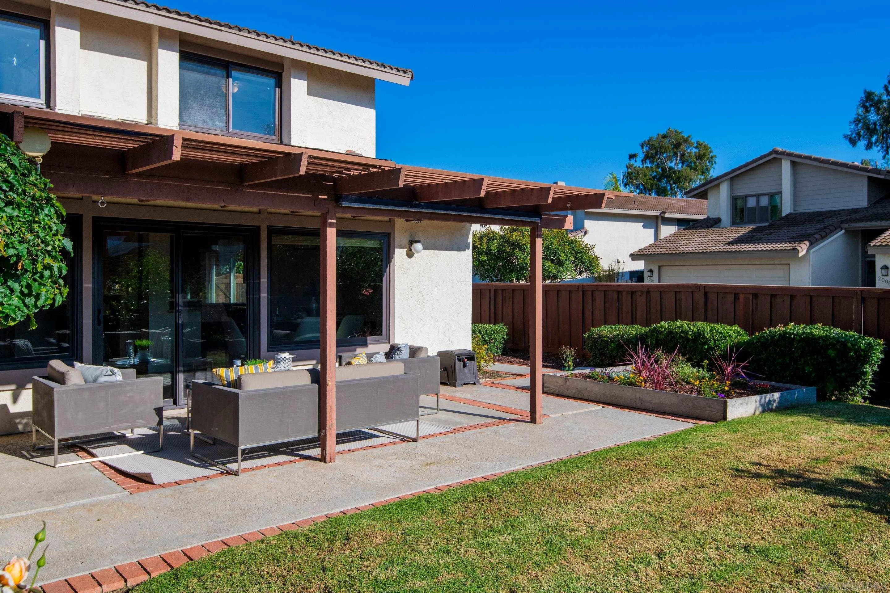 2002 Leafwood Place Encinitas, CA 92024 - Photo 36 of 64 a view of a house with backyard sitting area and garden