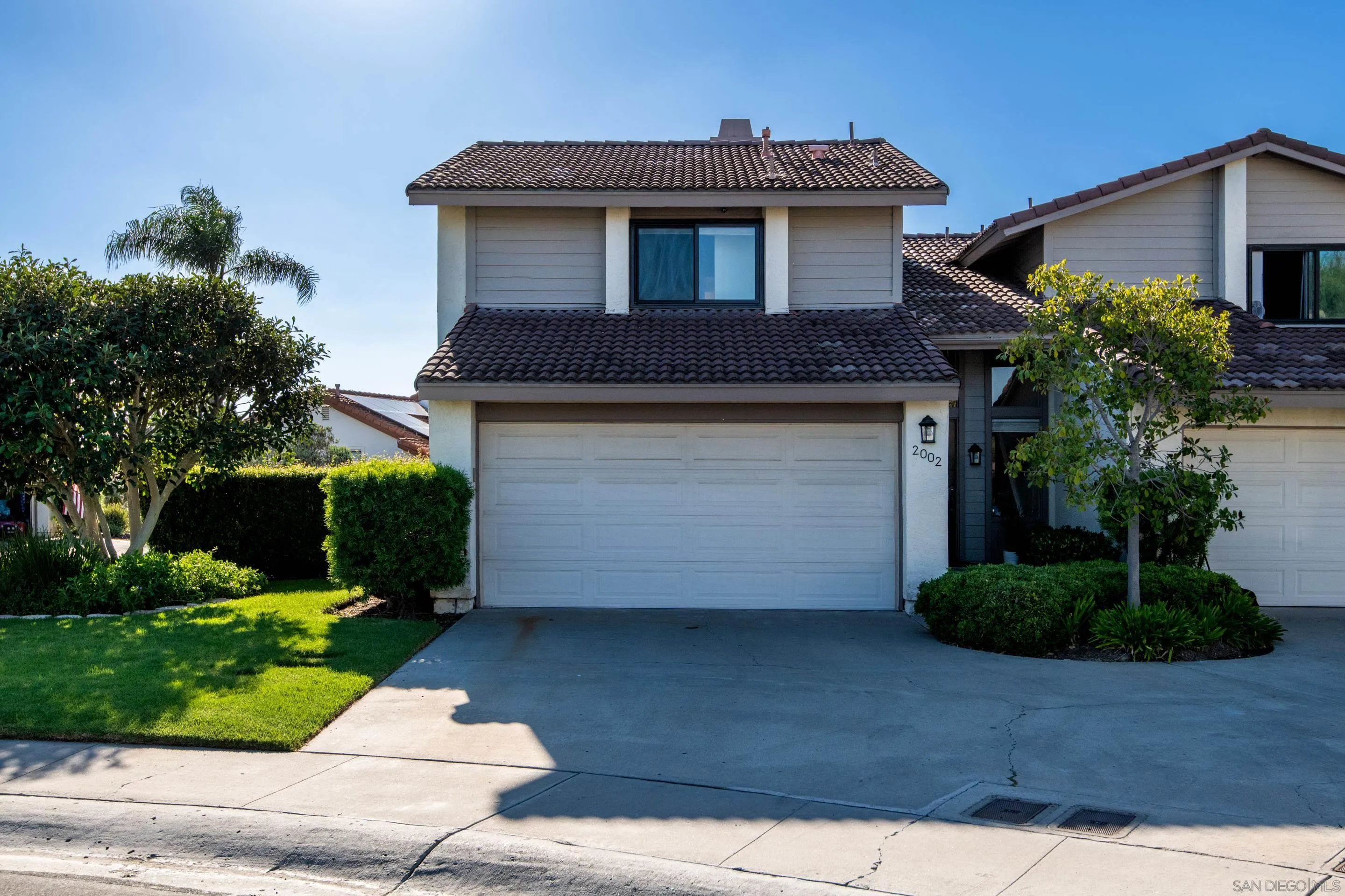 2002 Leafwood Place Encinitas, CA 92024 - Photo 64 of 64 a front view of a house with garden