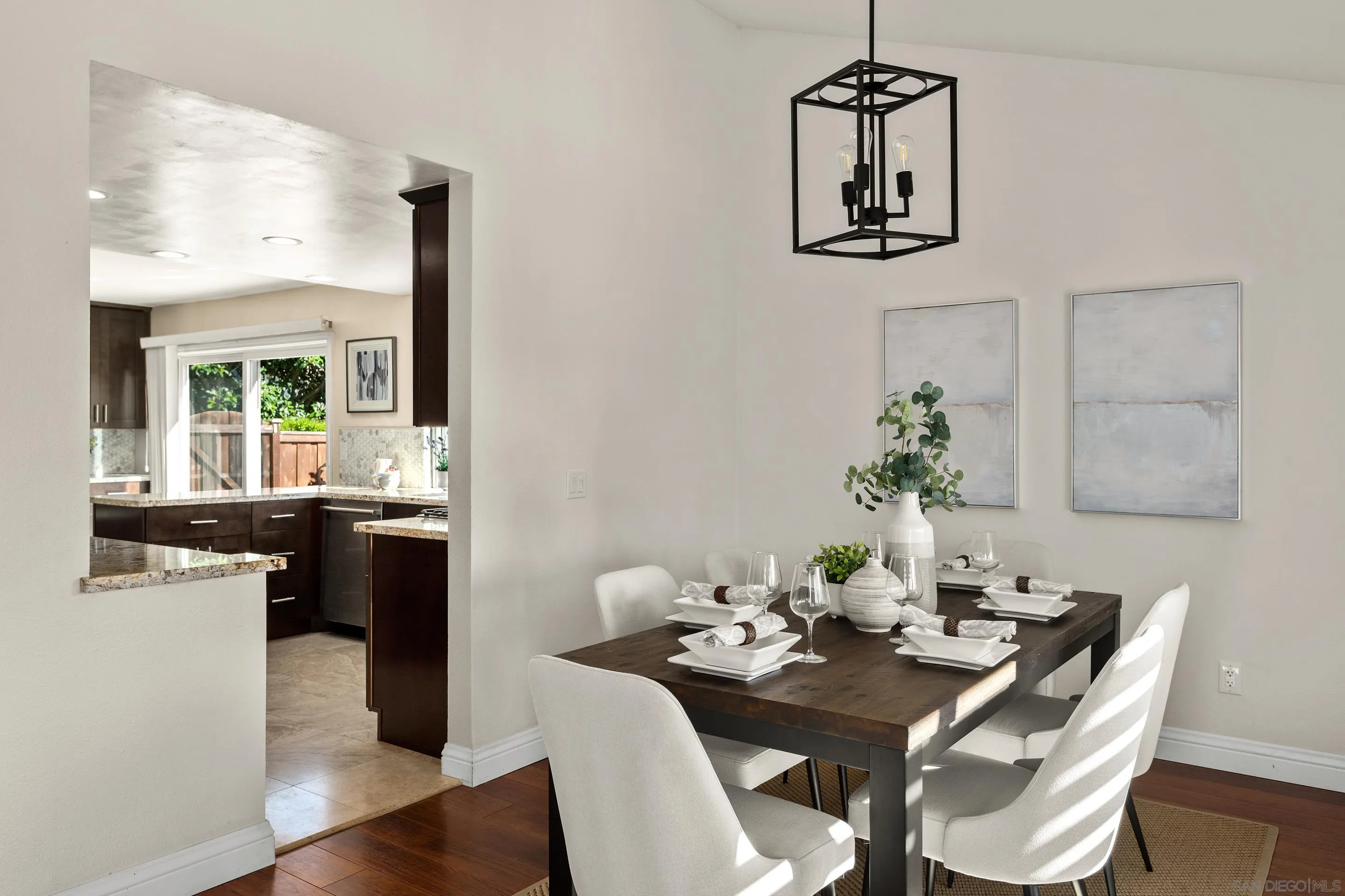 2002 Leafwood Place Encinitas, CA 92024 - Photo 10 of 64 a view of a dining room with furniture window and wooden floor