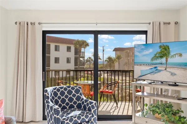 a view of a balcony with furniture