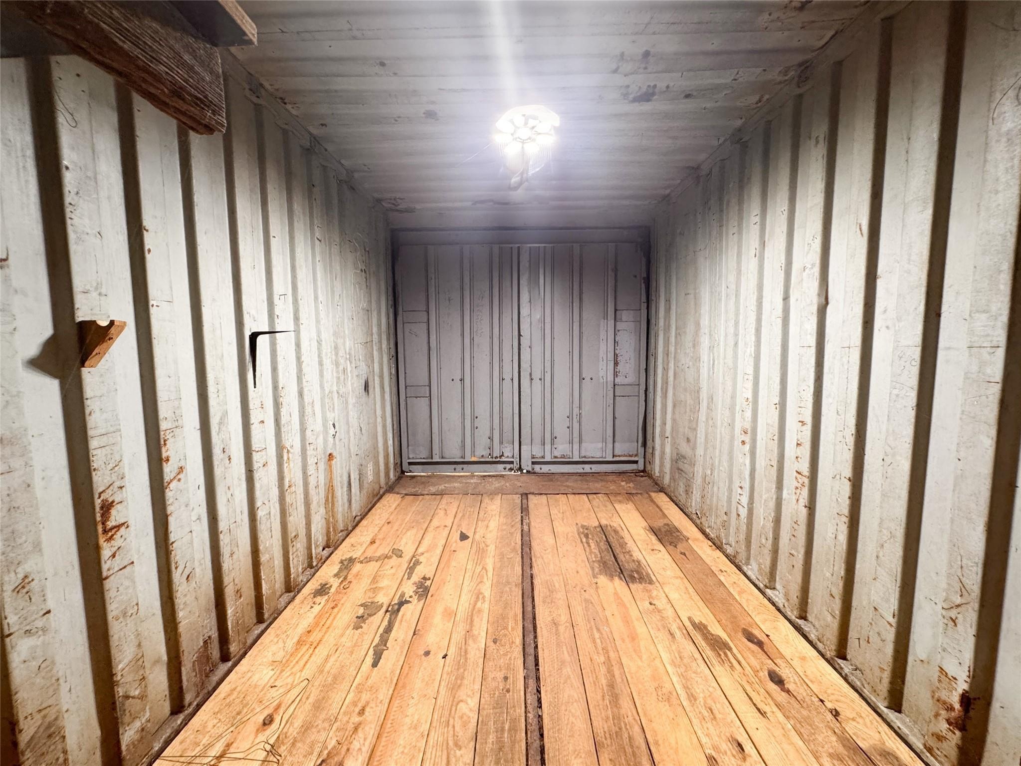 15331 Lake Lamond Road Conroe, TX 77384 - Photo 22 of 29 a view of a room with wooden floor and staircase