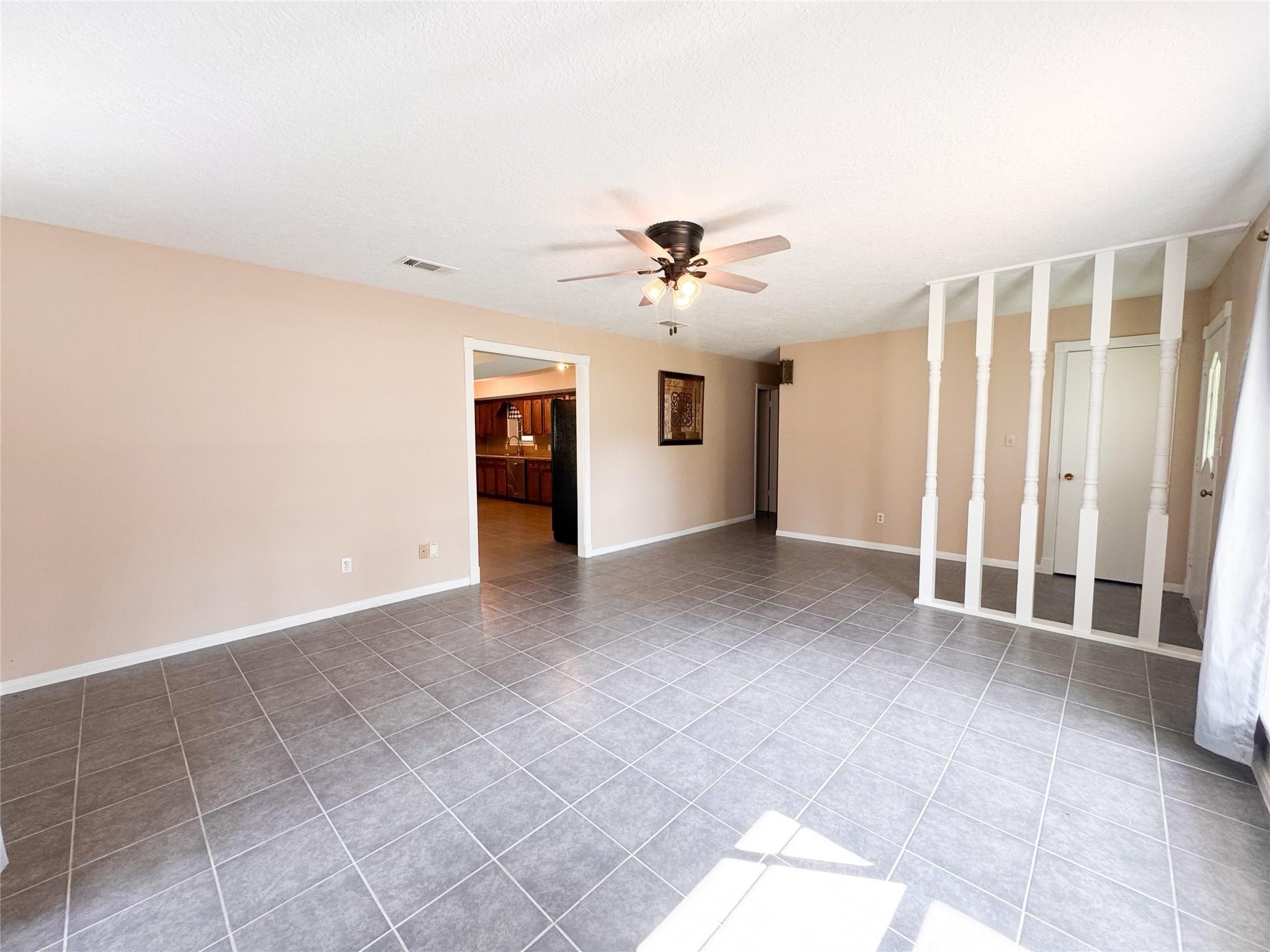 15331 Lake Lamond Road Conroe, TX 77384 - Photo 4 of 29 a view of an empty room with a window