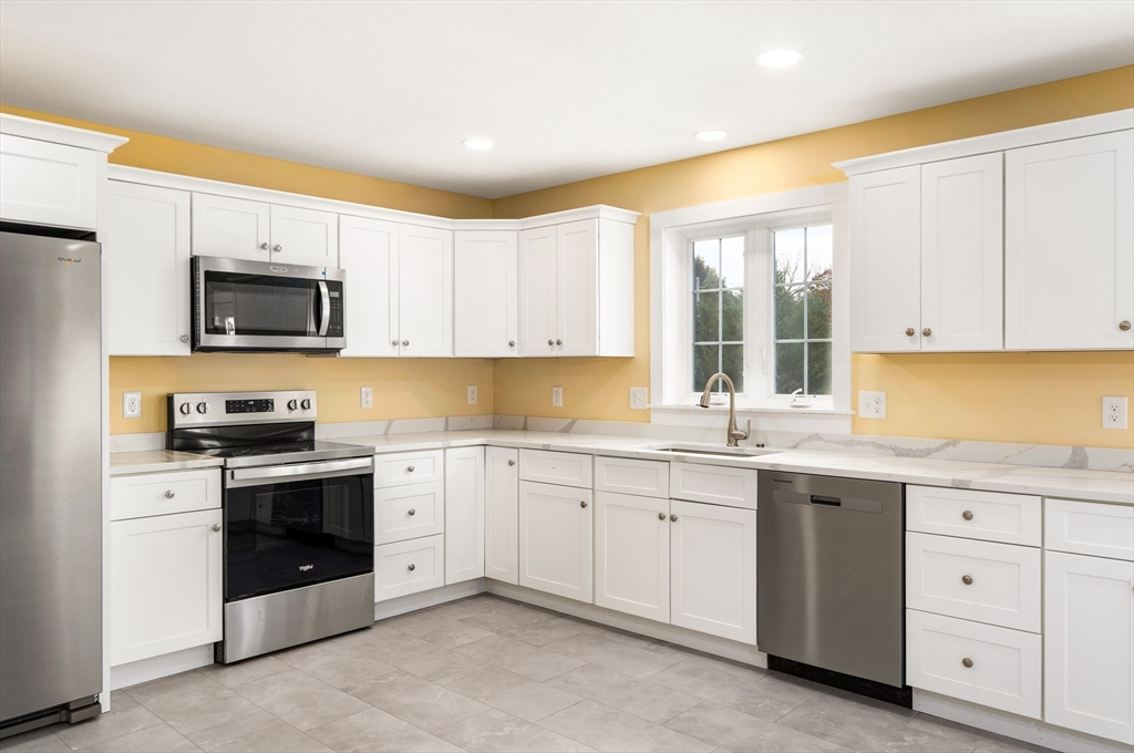 10 Glen Cove Place, Unit A Easthampton, MA 01027 - Photo 14 of 39 a kitchen with a sink stove and microwave