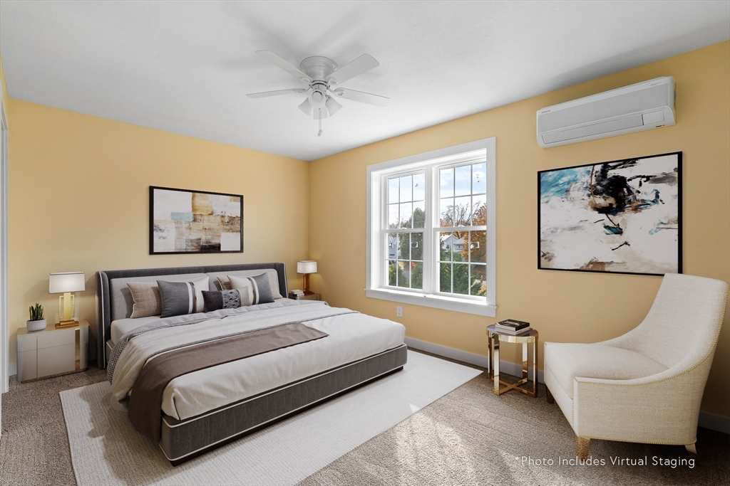 10 Glen Cove Place, Unit A Easthampton, MA 01027 - Photo 27 of 39 a bedroom with a large bed and a couch