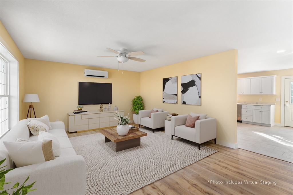10 Glen Cove Place, Unit A Easthampton, MA 01027 - Photo 3 of 39 a living room with furniture and a flat screen tv