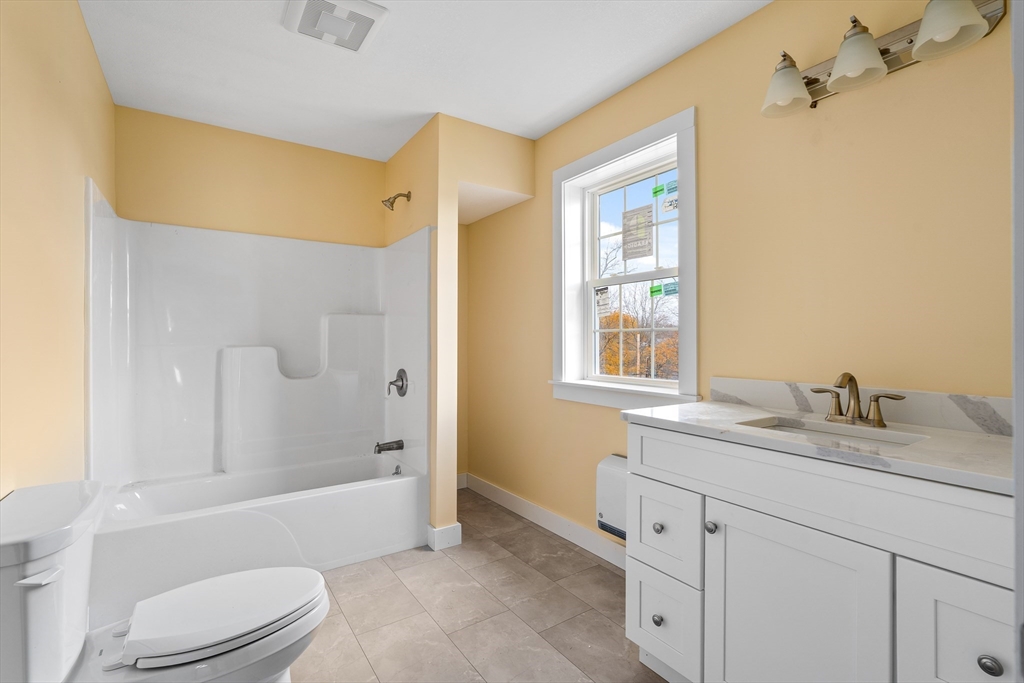 10 Glen Cove Place, Unit A Easthampton, MA 01027 - Photo 31 of 39 a bathroom with a granite countertop sink toilet and shower