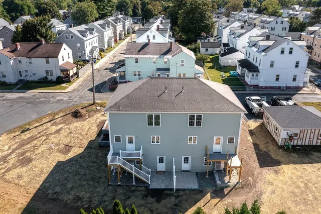 an aerial view of a house with a garden