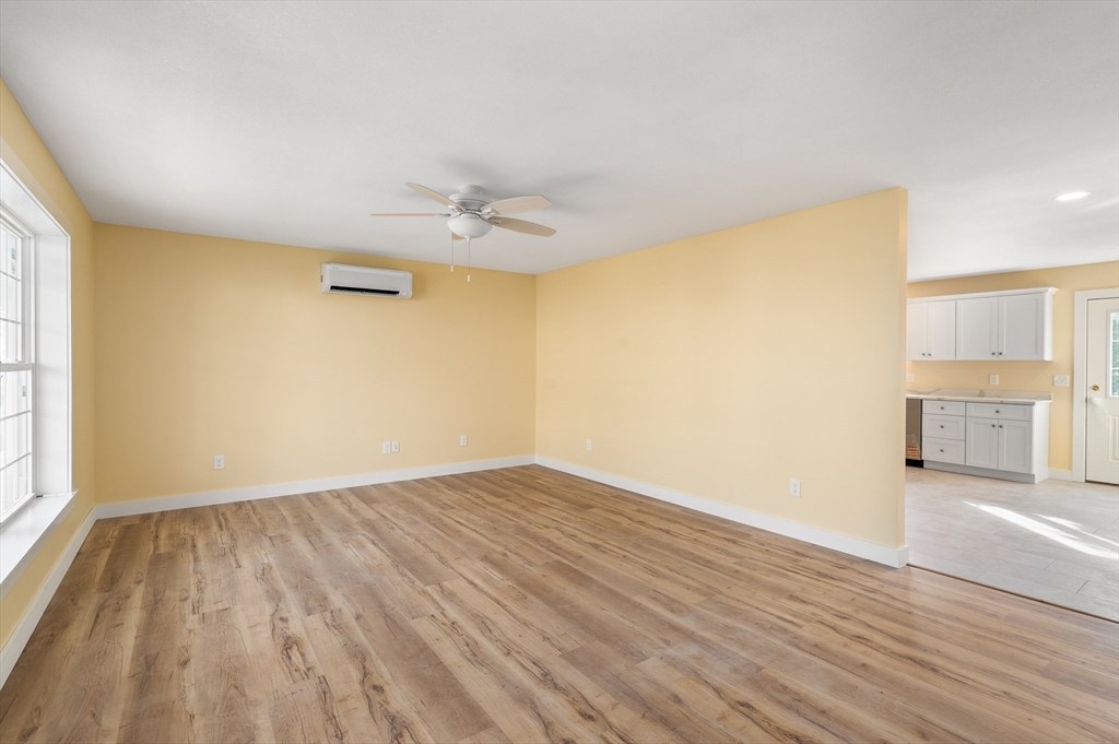 10 Glen Cove Place, Unit A Easthampton, MA 01027 - Photo 4 of 39 wooden floor in an empty room with a window