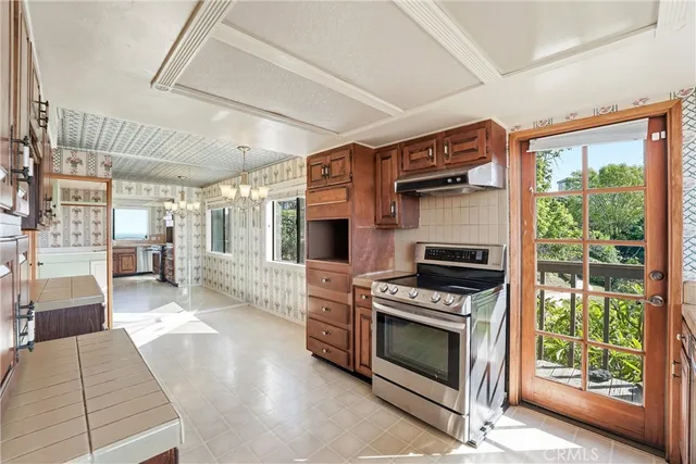 a kitchen with refrigerator and cabinets