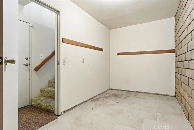 a view of a hallway with stairs