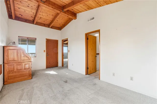 a view of a swimming pool with a yard