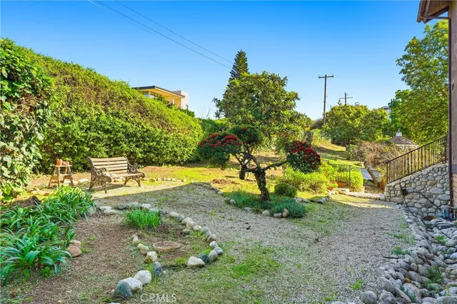 an aerial view of a house with a yard and garden
