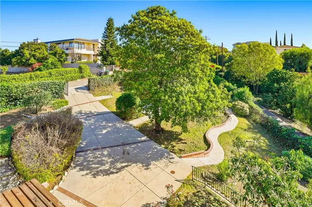 a view of mountain with green field