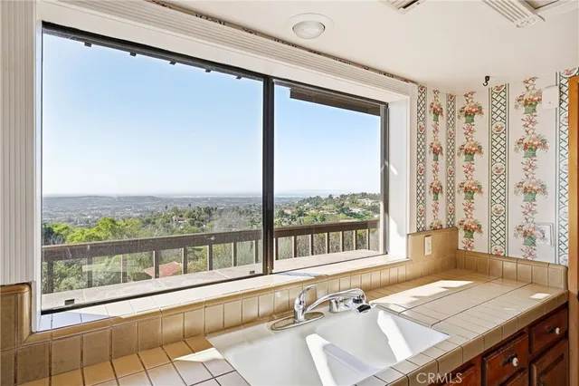 a view of a balcony with wooden floor