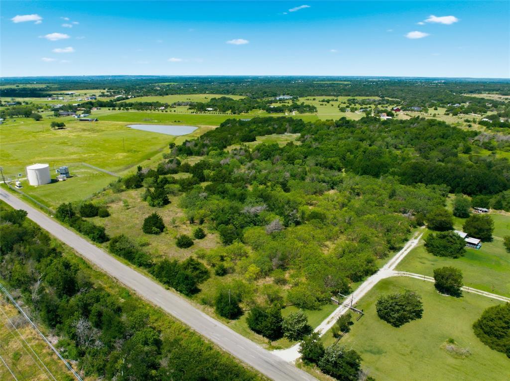 663 North Katy Road Elm Mott, TX 76640 - Photo 2 of 25 Scenic rural acreage featuring a mix of open fields and mature tree coverage