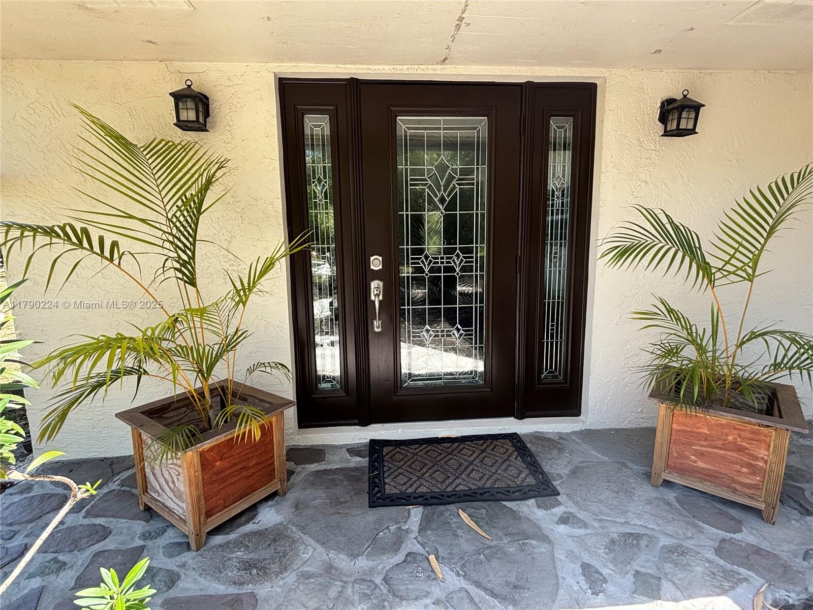 7219 Wilson Road West Palm Beach, FL 33413 - Photo 50 of 77 a living room with a couch and a potted plant