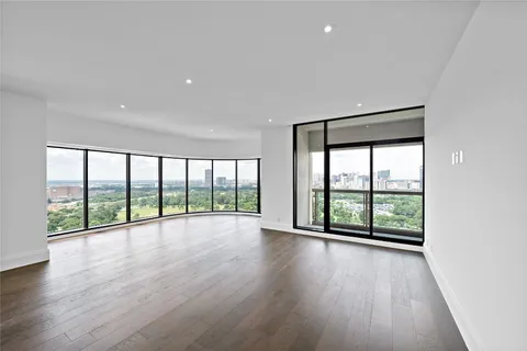 a kitchen with stainless steel appliances a white stove top oven and a large window