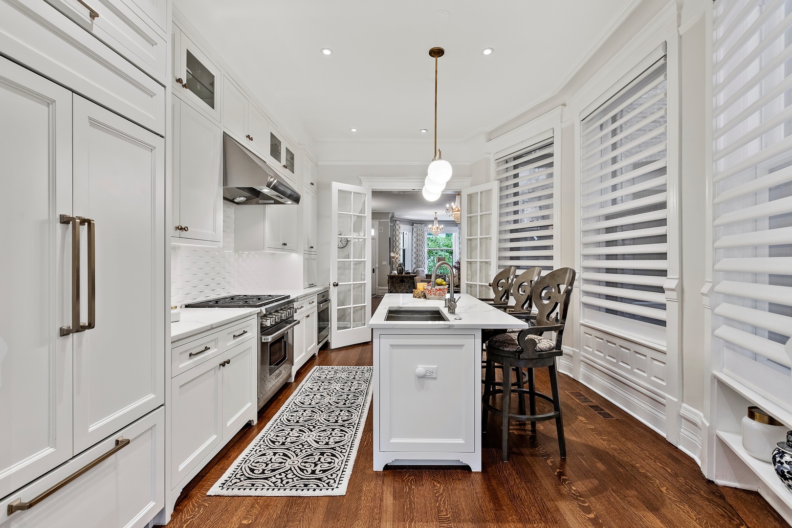 1304 North Ritchie Court Chicago, IL 60610 - Photo 18 of 39 a kitchen with stainless steel appliances granite countertop a stove a sink dishwasher and a refrigerator with wooden floor