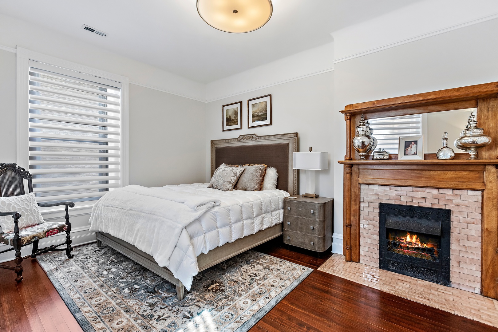 1304 North Ritchie Court Chicago, IL 60610 - Photo 34 of 39 a bedroom with a bed and a fireplace