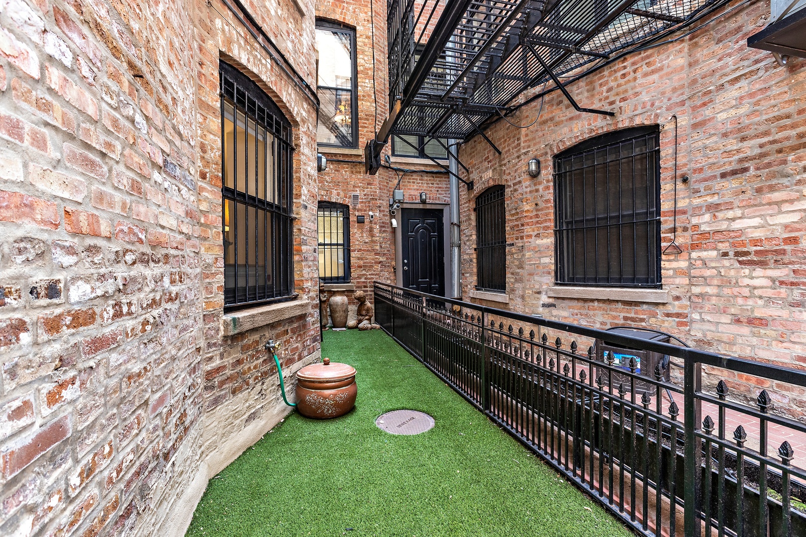 1304 North Ritchie Court Chicago, IL 60610 - Photo 39 of 39 a view of a chair and table in backyard of the house