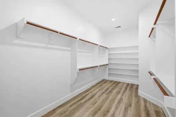 a storage room with wooden floor