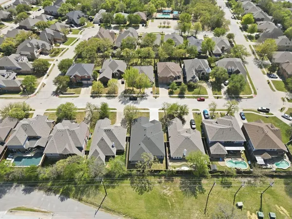 a aerial view of residential houses with outdoor space