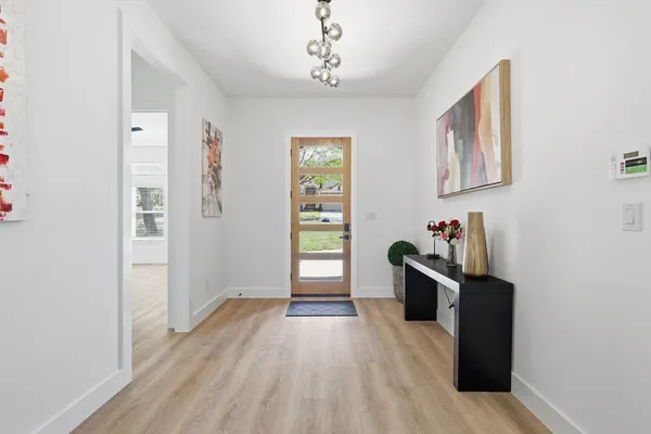 a view of a workspace with wooden floor and bedroom