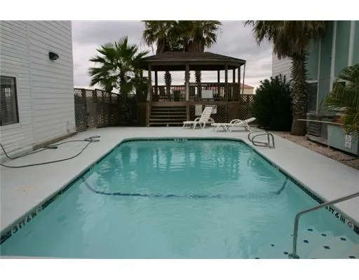 a view of swimming pool outdoor seating