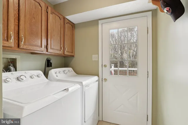 a spacious bathroom with a sink and a mirror