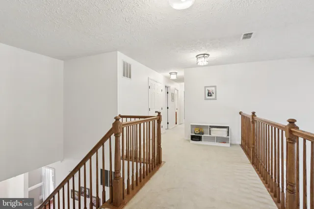 a bathroom with a toilet and a window