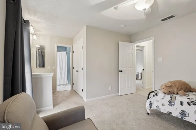 a bathroom with a bathtub shower sink and mirror