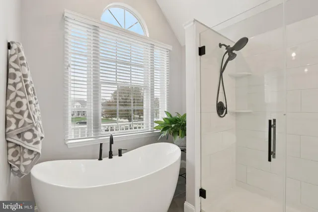 a view of a house with a small yard and plants