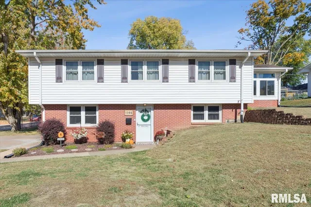 a front view of house with yard