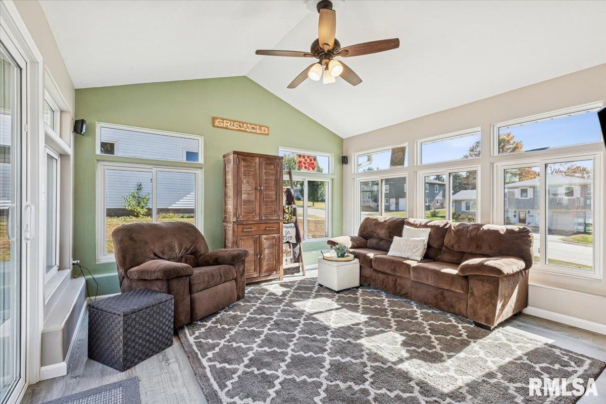 1146 6th Avenue North Clinton, IA 52732 - Photo 15 of 27 a living room with furniture ceiling fan and a rug