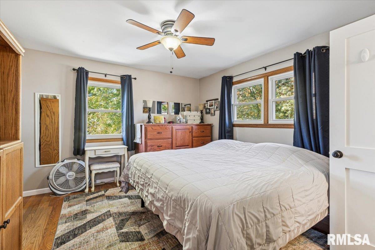 1146 6th Avenue North Clinton, IA 52732 - Photo 16 of 27 a bedroom with a large bed and a large window