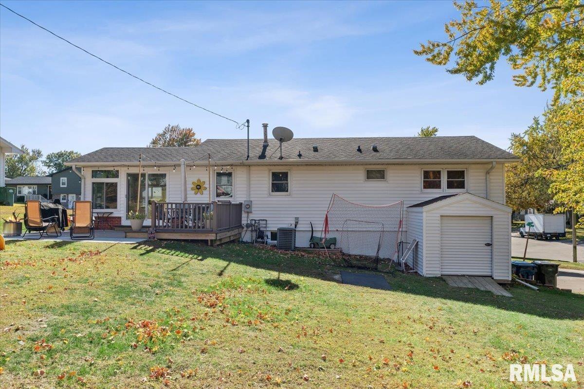 1146 6th Avenue North Clinton, IA 52732 - Photo 6 of 27 a front view of a house with a yard table and chairs