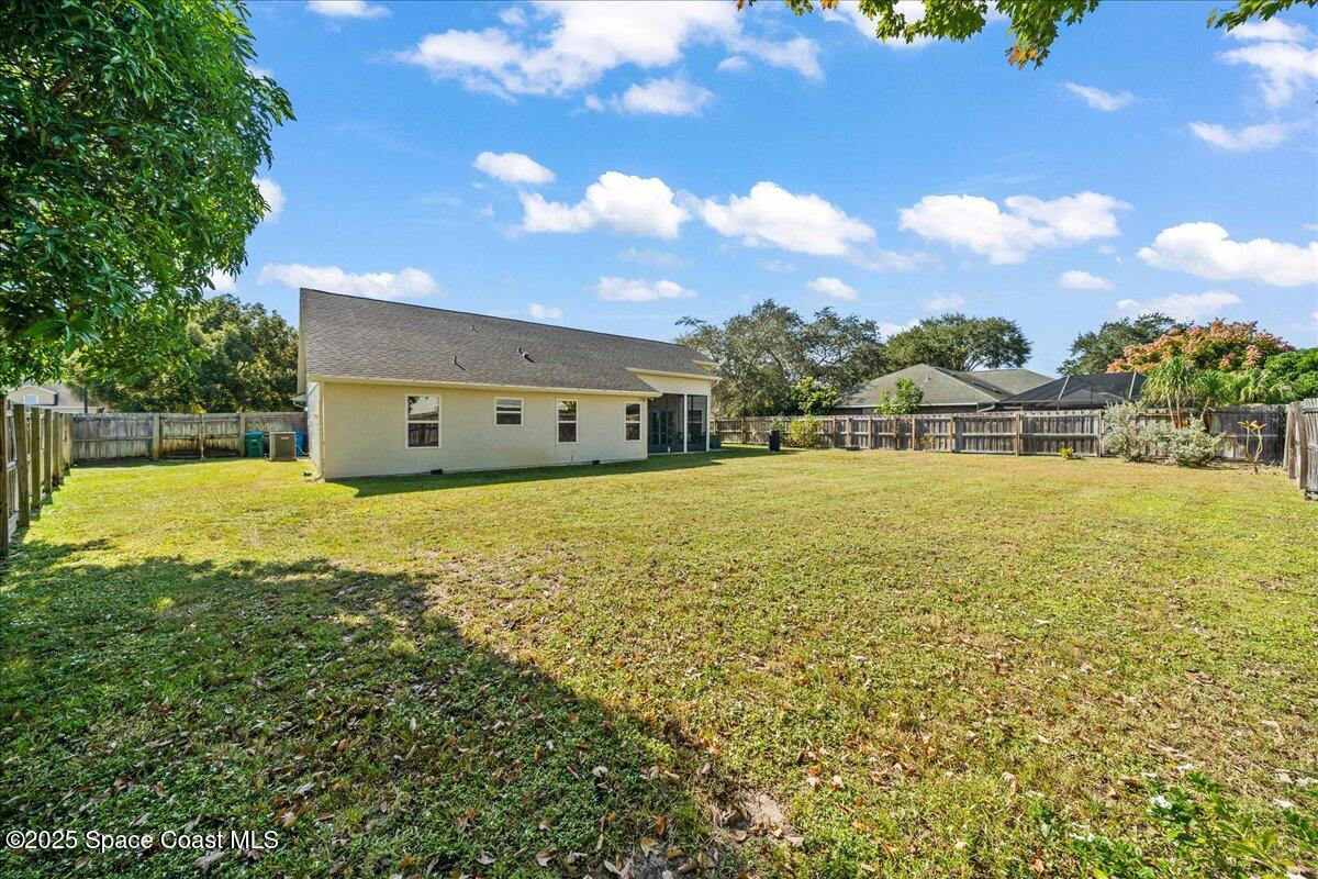 910 Brookshire Circle Malabar, FL 32950 - Photo 23 of 29 a view of an ocean house and a yard