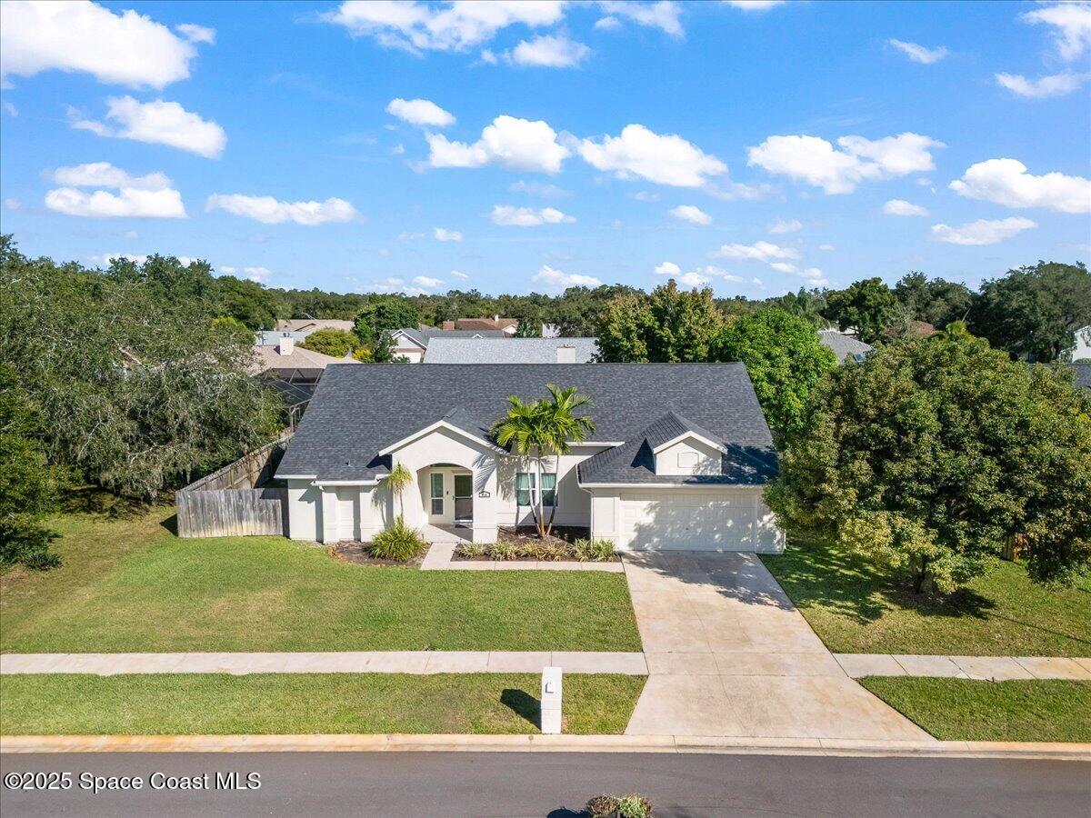 910 Brookshire Circle Malabar, FL 32950 - Photo 24 of 29 a view of house with a yard and a street view