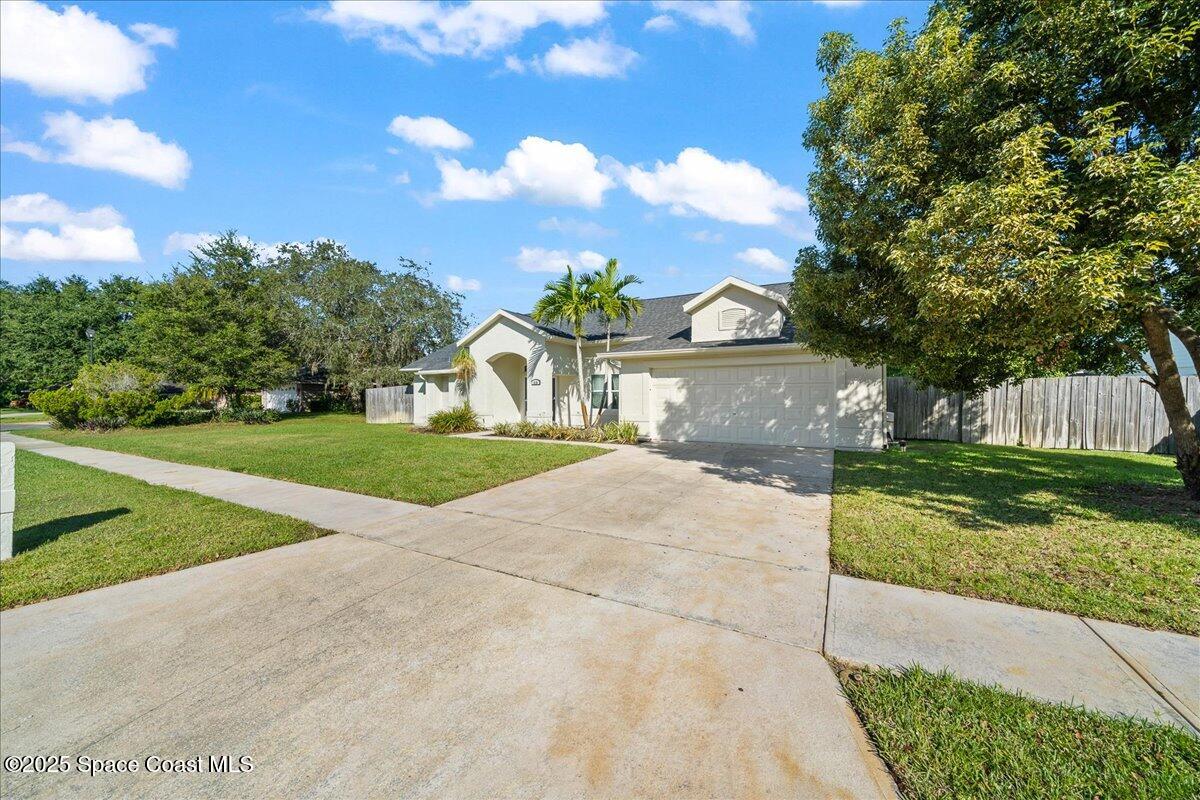 910 Brookshire Circle Malabar, FL 32950 - Photo 28 of 29 a view of white house with a yard