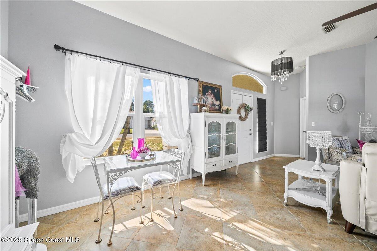 910 Brookshire Circle Malabar, FL 32950 - Photo 6 of 29 a living room filled with furniture and a table