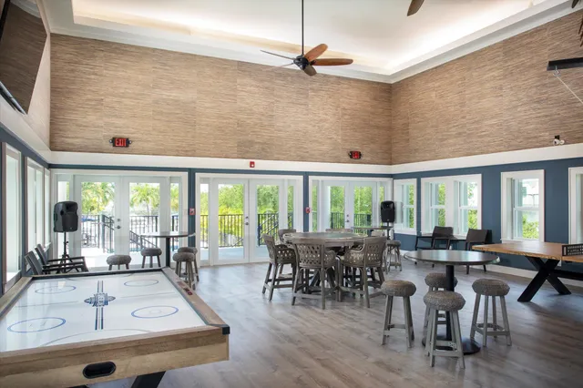 a view of a swimming pool with a patio and a yard