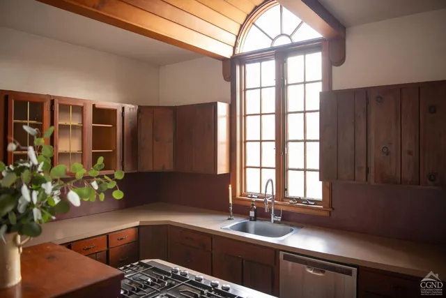 a bedroom with two beds and a window