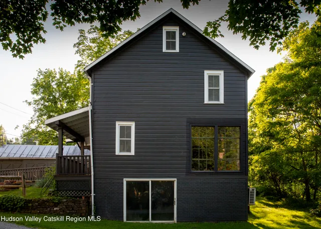 a view of a hallway with wooden door