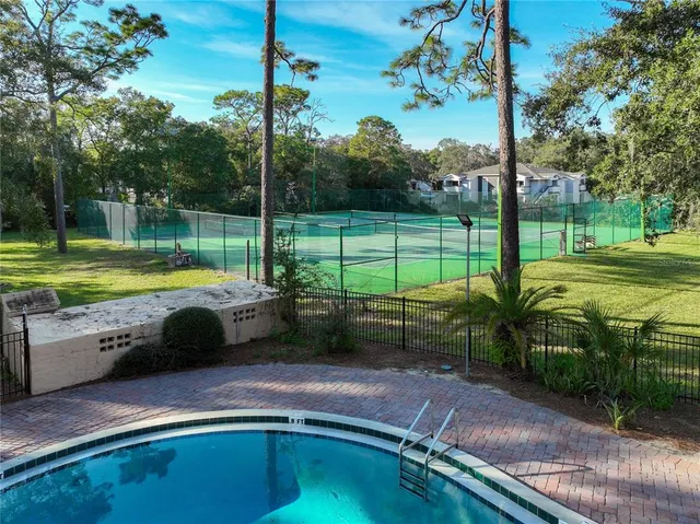 a view of a swimming pool with a garden