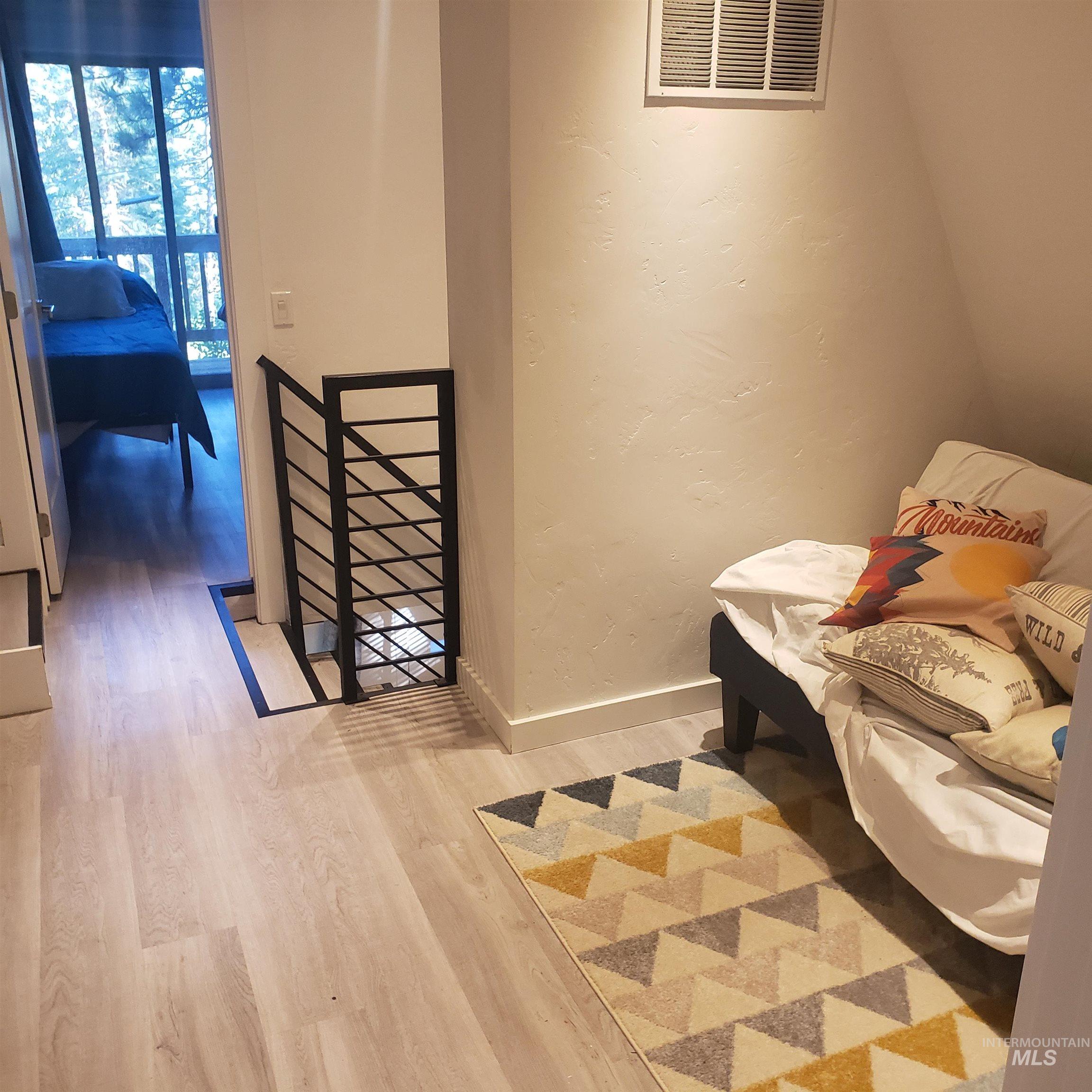 1098 Crescent Rim Drive McCall, ID 83638 - Photo 21 of 42 Sitting room featuring a textured wall and light wood finished floors