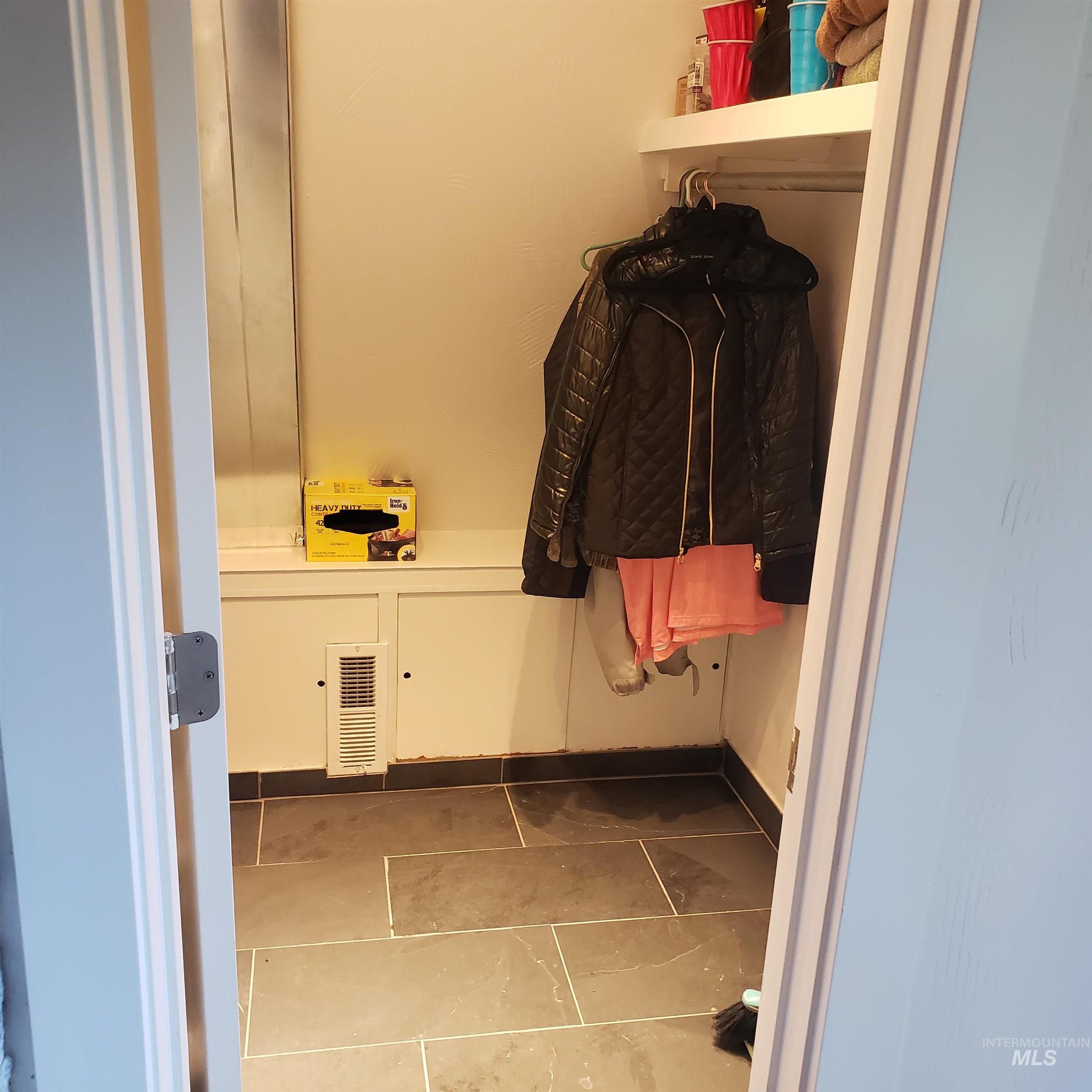 1098 Crescent Rim Drive McCall, ID 83638 - Photo 30 of 42 Laundry area featuring light tile patterned flooring and baseboards
