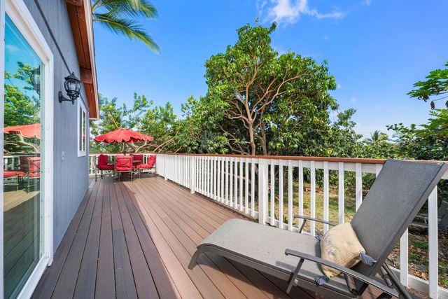 a view of balcony with furniture