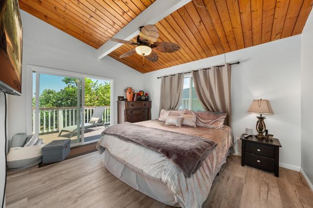 a bed room with a bed and a couch