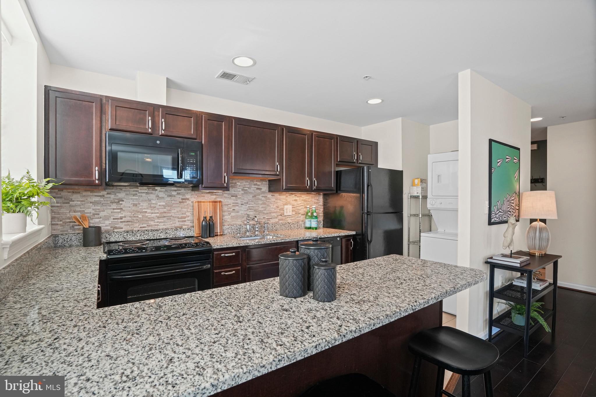 2627 Adams Mill Road Northwest, Unit 402 Washington, DC 20009 - Photo 7 of 17 Kitchen with washer/dryer