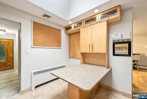 a view of a room that has a couch and a stove in it